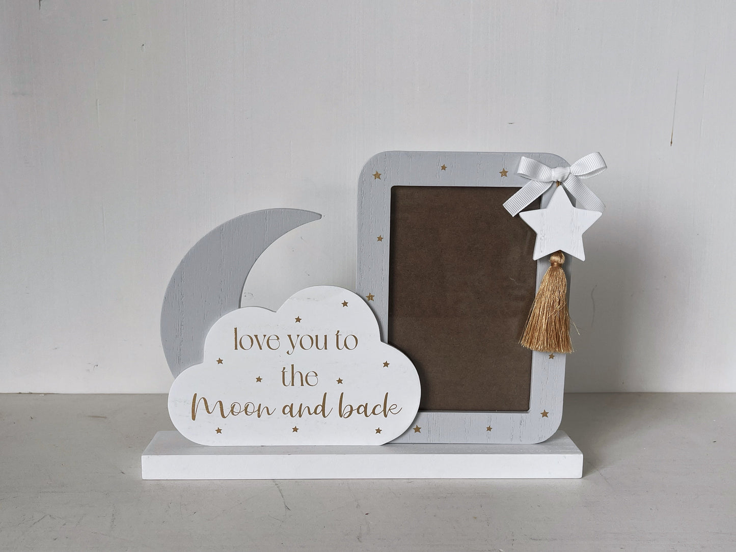 Charming 4x3 wooden baby photo frame featuring cloud, moon, and star decorations. A cute and versatile home decor piece, perfect for baby rooms or nurseries, and makes a thoughtful gift for new parents. 3
