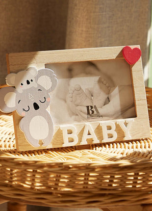 A charming wooden baby photo frame featuring an adorable koala design, perfect for displaying cherished baby photos. This whimsical frame is an ideal home decor piece for any nursery or living room, making it a thoughtful gift for new parents or families with babies. This baby photo frame makes a wonderful gift for baby showers or any special occasion, combining functionality and cute design to celebrate the arrival of a new baby. 3
