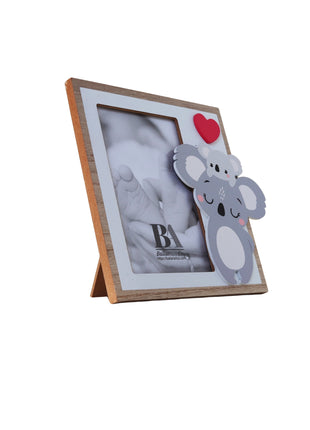 A charming wooden baby photo frame featuring an adorable koala design, perfect for displaying cherished baby photos. This whimsical frame is an ideal home decor piece for any nursery or living room, making it a thoughtful gift for new parents or families with babies. This baby photo frame makes a wonderful gift for baby showers or any special occasion, combining functionality and cute design to celebrate the arrival of a new baby. 5
