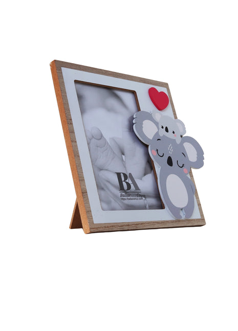 A charming wooden baby photo frame featuring an adorable koala design, perfect for displaying cherished baby photos. This whimsical frame is an ideal home decor piece for any nursery or living room, making it a thoughtful gift for new parents or families with babies. This baby photo frame makes a wonderful gift for baby showers or any special occasion, combining functionality and cute design to celebrate the arrival of a new baby. 5
