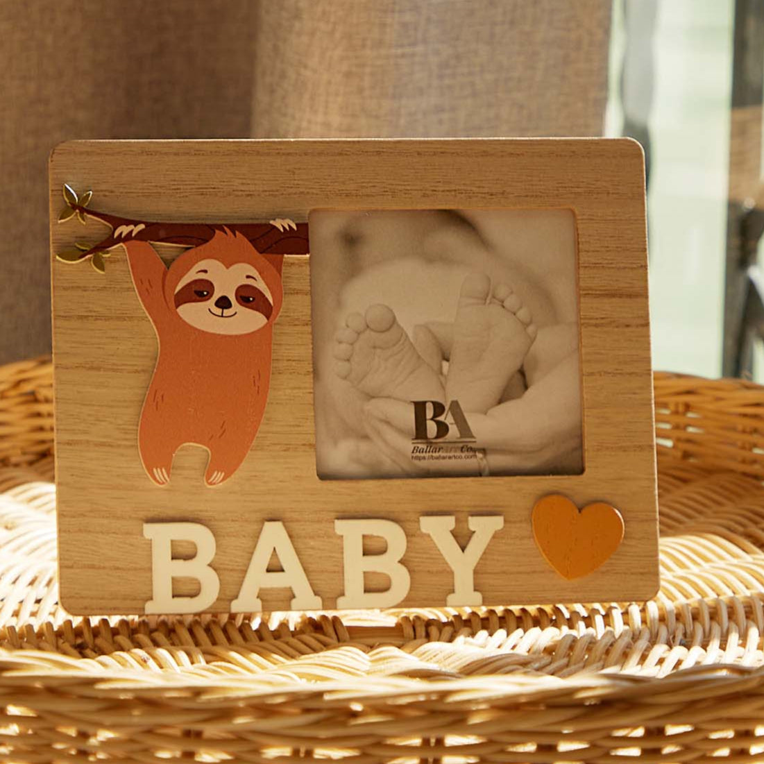 A charming wooden baby photo frame featuring an adorable sloth design, perfect for displaying cherished baby photos. This whimsical frame is an ideal home decor piece for any nursery or living room, making it a thoughtful gift for new parents or families with babies. With its cute sloth illustration and durable wooden construction, it adds a playful touch to any room while preserving precious memories. This baby photo frame makes a wonderful gift for baby showers or any special occasion, combining functiona