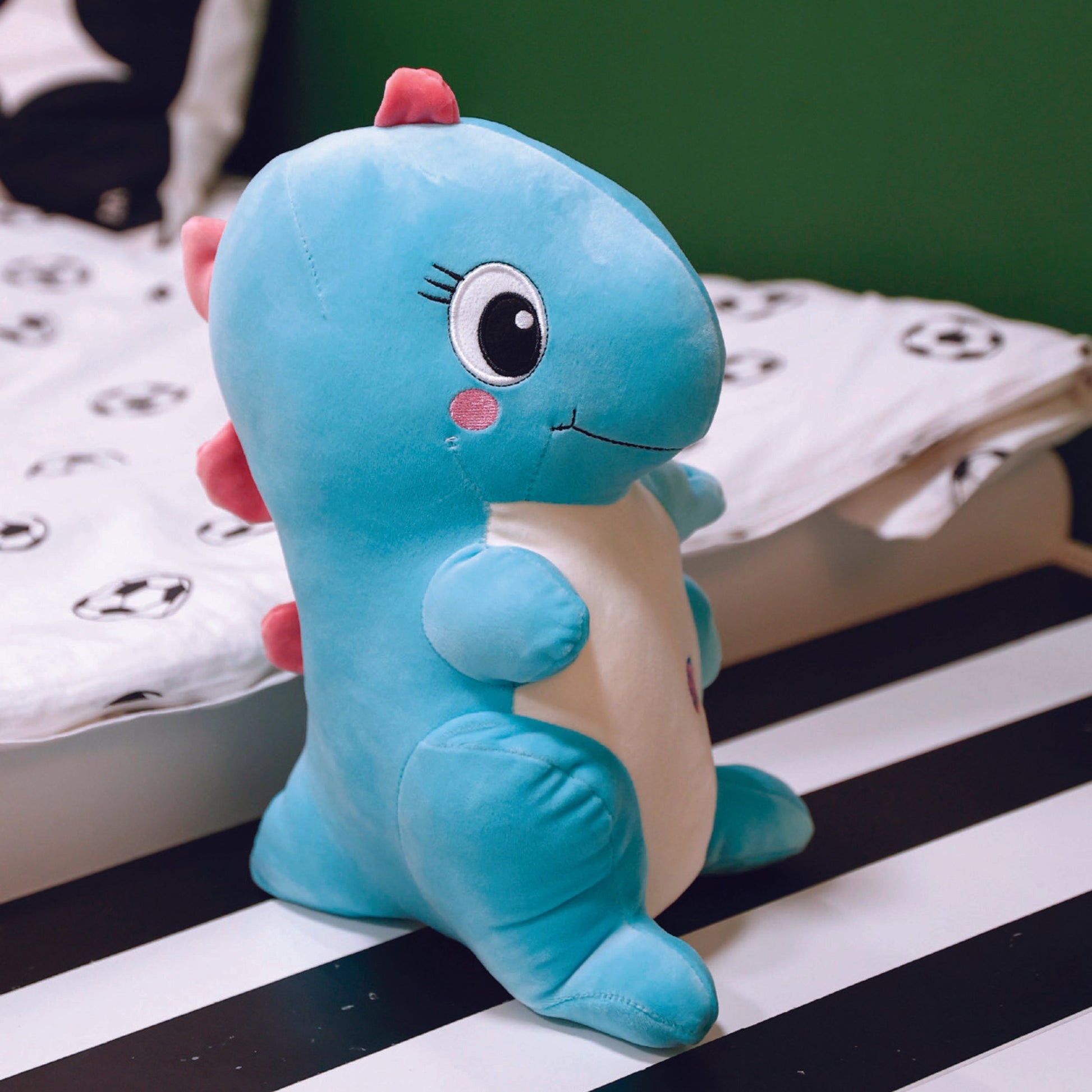 Adorable blue dinosaur plush toy, soft and squishy, perfect for cuddling. This cute dinosaur stuffed animal doubles as a pillow for kids, making it an ideal plushie for playtime or bedtime. A must-have for dinosaur lovers and fans of squishmallow-style toys. 5
