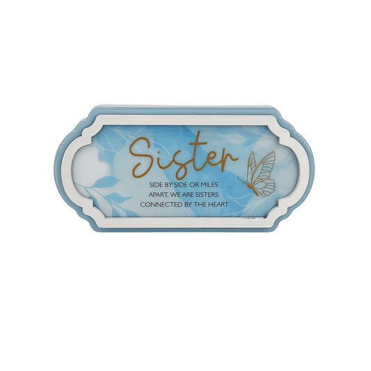 A beautifully designed blue decorative ornament, perfect for gifting to a sister. This home decor piece features a thoughtful design that symbolizes love and connection, making it an ideal gift for birthdays, holidays, or any special occasion. The elegant blue color and charming details make it a meaningful addition to any room, showcasing your affection and appreciation for your sister. This ornament serves as a heartfelt reminder of the bond shared with your sibling, bringing a touch of warmth and beauty 