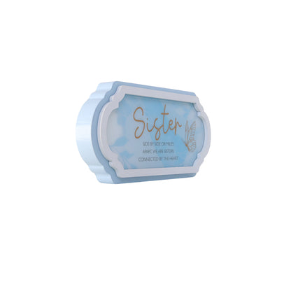 A beautifully designed blue decorative ornament, perfect for gifting to a sister. This home decor piece features a thoughtful design that symbolizes love and connection, making it an ideal gift for birthdays, holidays, or any special occasion. The elegant blue color and charming details make it a meaningful addition to any room, showcasing your affection and appreciation for your sister. This ornament serves as a heartfelt reminder of the bond shared with your sibling, bringing a touch of warmth and beauty 