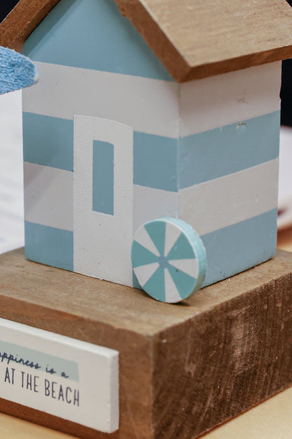 Charming coastal cottage miniature house decor in a beautiful seaside style, Happiness is a Day at the Beach ,featuring a blue color scheme and intricate wooden design. This elegant home ornament adds a coastal vibe to any space, perfect for living rooms, offices, or as a gift for beach lovers. 3
