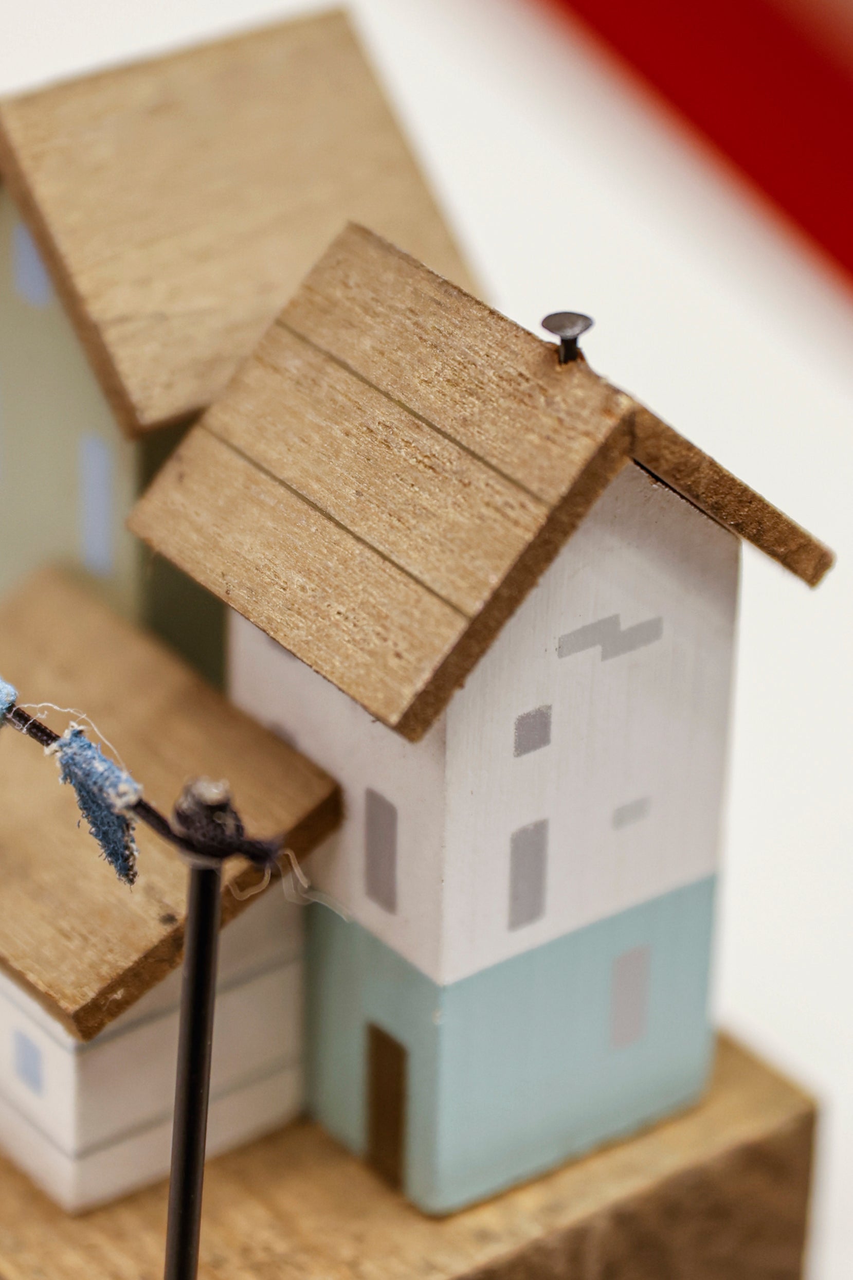 Charming coastal cottage miniature house decor in a beautiful seaside style, Life is Better by the Seaside, featuring a blue color scheme and intricate wooden design. This elegant home ornament adds a coastal vibe to any space, perfect for living rooms, offices, or as a gift for beach lovers. 3
