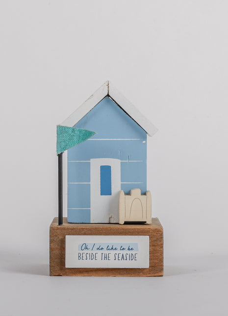 Charming coastal cottage miniature house decor in a beautiful seaside style,  Oh I Do Like to be Beside the Seaside, featuring a blue color scheme and intricate wooden design. This elegant home ornament adds a coastal vibe to any space, perfect for living rooms, offices, or as a gift for beach lovers. 2
