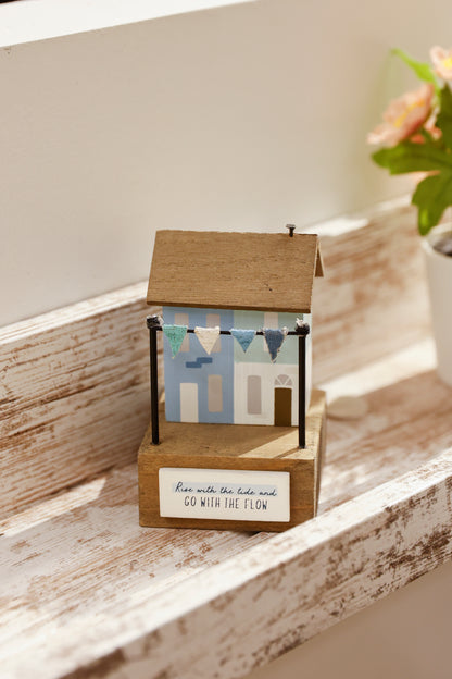 Charming coastal cottage miniature house decor in a beautiful seaside style, Rise with the Tide and Go with the Flow ,featuring a blue color scheme and intricate wooden design. This elegant home ornament adds a coastal vibe to any space, perfect for living rooms, offices, or as a gift for beach lovers. 4
