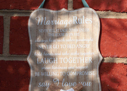 Elegant wooden hanging room decor featuring "Marriage Rules" with beautifully designed typography, perfect as a wedding gift or anniversary keepsake for newlyweds, adding a charming and sentimental touch to their home. Ideal for displaying in living rooms, bedrooms, or kitchens to celebrate love and marriage. 2
