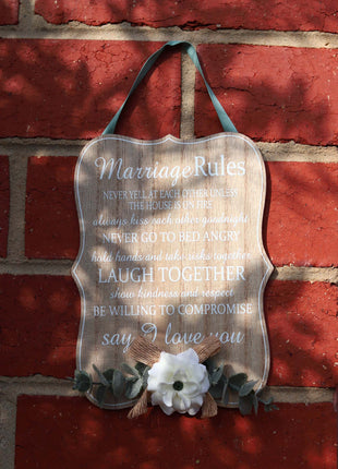 Elegant wooden hanging room decor featuring "Marriage Rules" with beautifully designed typography, perfect as a wedding gift or anniversary keepsake for newlyweds, adding a charming and sentimental touch to their home. Ideal for displaying in living rooms, bedrooms, or kitchens to celebrate love and marriage. 2
