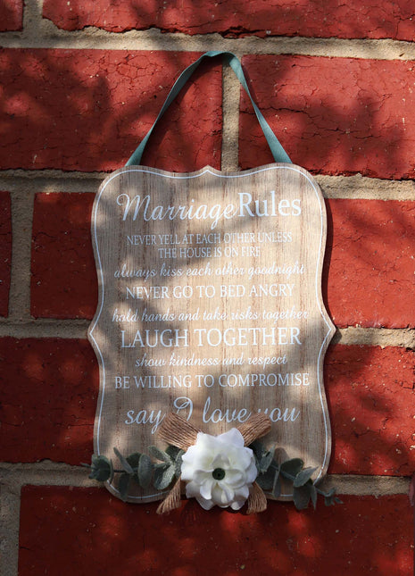 Elegant wooden hanging room decor featuring "Marriage Rules" with beautifully designed typography, perfect as a wedding gift or anniversary keepsake for newlyweds, adding a charming and sentimental touch to their home. Ideal for displaying in living rooms, bedrooms, or kitchens to celebrate love and marriage. 2
