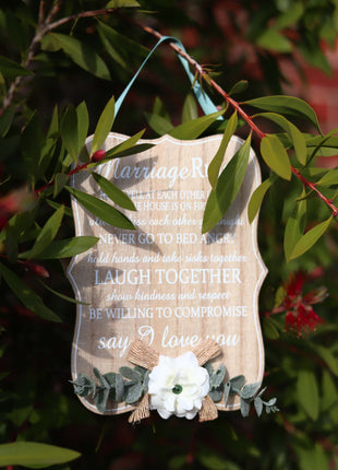 Elegant wooden hanging room decor featuring "Marriage Rules" with beautifully designed typography, perfect as a wedding gift or anniversary keepsake for newlyweds, adding a charming and sentimental touch to their home. Ideal for displaying in living rooms, bedrooms, or kitchens to celebrate love and marriage. 3
