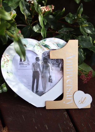 Heart-shaped photo frame featuring the word "Anniversary" and the number 1, a perfect romantic gift for couples celebrating their first anniversary, capturing cherished memories as a keepsake. 3
