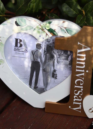 Heart-shaped photo frame featuring the word "Anniversary" and the number 1, a perfect romantic gift for couples celebrating their first anniversary, capturing cherished memories as a keepsake. 5
