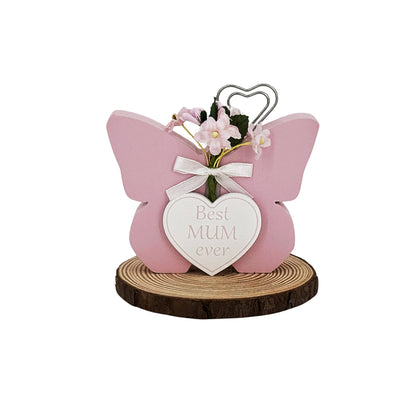 A beautifully crafted pink butterfly-shaped wooden decoration, designed as a thoughtful Mother’s Day gift for mom. This elegant and unique piece adds a personal touch to any home decor, celebrating the love and appreciation for mothers on their special day. Perfect for displaying in the living room, bedroom, or anywhere that can be brightened by this charming gift. 1
