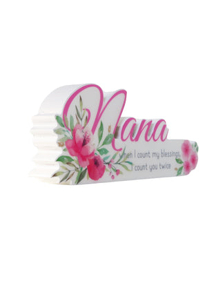 A charming floral vase featuring the word "Nana" in beautiful lettering, surrounded by vibrant flowers. This elegant home decor piece is designed as a thoughtful gift for grandma, perfect for birthdays, holidays, or any special occasion. The floral details and personalized "Nana" text make it a meaningful and heartfelt present, adding warmth and beauty to her home. Ideal for showing love and appreciation, this vase serves as both a decorative ornament and a lasting reminder of your special bond with your gr