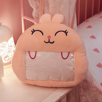 Adorable pink bunny plush toy, cartoon rabbit stuffed toy with a soft blanket inside and a hand-warmer feature in its belly. This multi-functional stuffed animal offers comfort and warmth. Soft and cuddly, this squishmallow-style stuffed animal doubles as a pillow for kids, making it the perfect plushie and comfort companion for bedtime or playtime. 5
