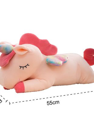 Adorable pink unicorn plush toy with rainbow wings, featuring a cozy unicorn blanket tucked inside its belly. Soft and cuddly, this squishmallow-style stuffed animal doubles as a pillow for kids, making it the perfect plushie and comfort companion for bedtime or playtime. 2
