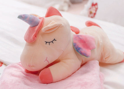 Adorable pink unicorn plush toy with rainbow wings, featuring a cozy unicorn blanket tucked inside its belly. Soft and cuddly, this squishmallow-style stuffed animal doubles as a pillow for kids, making it the perfect plushie and comfort companion for bedtime or playtime. 3
