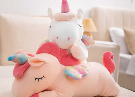 Adorable pink unicorn plush toy with rainbow wings, featuring a cozy unicorn blanket tucked inside its belly. Soft and cuddly, this squishmallow-style stuffed animal doubles as a pillow for kids, making it the perfect plushie and comfort companion for bedtime or playtime. 4
