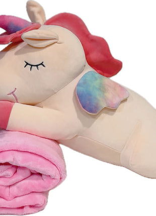 Adorable pink unicorn plush toy with rainbow wings, featuring a cozy unicorn blanket tucked inside its belly. Soft and cuddly, this squishmallow-style stuffed animal doubles as a pillow for kids, making it the perfect plushie and comfort companion for bedtime or playtime. 5
