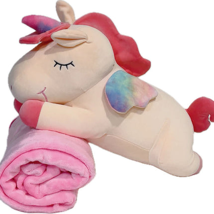 Adorable pink unicorn plush toy with rainbow wings, featuring a cozy unicorn blanket tucked inside its belly. Soft and cuddly, this squishmallow-style stuffed animal doubles as a pillow for kids, making it the perfect plushie and comfort companion for bedtime or playtime. 5
