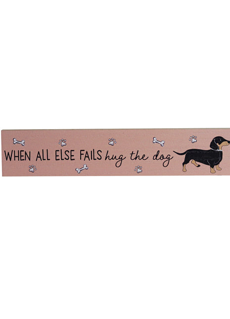 Charming pink wooden room decor featuring adorable dog illustrations and heartwarming quotes, designed as a thoughtful and compact gift for dog lovers. This small wooden ornament is perfect for shelves, tables, or any cozy space in a pet-friendly home. 1
