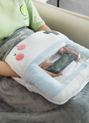 Adorable white game console-shaped plush toy with a soft blanket inside and a hand-warmer feature in its belly. This multi-functional stuffed animal offers comfort and warmth, making it a perfect squishmallow-style throw pillow or plushie for cozy relaxation. 3

