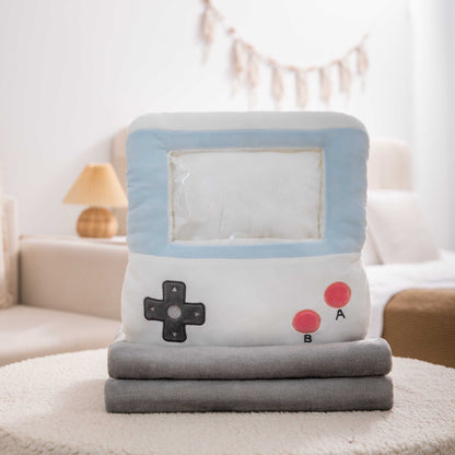 Adorable white game console-shaped plush toy with a soft blanket inside and a hand-warmer feature in its belly. This multi-functional stuffed animal offers comfort and warmth, making it a perfect squishmallow-style throw pillow or plushie for cozy relaxation. 4
