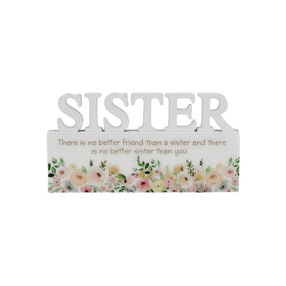 A charming white decorative ornament featuring the word "Sister" with beautiful floral patterns, making it an ideal home decor gift for your sister. The delicate floral design adds a touch of elegance and warmth, making it a perfect gift for birthdays, holidays, or any special occasion. This meaningful ornament symbolizes the love and connection shared between siblings and serves as a reminder of cherished moments. The simple yet elegant white color complements any home decor style, creating a heartfelt and
