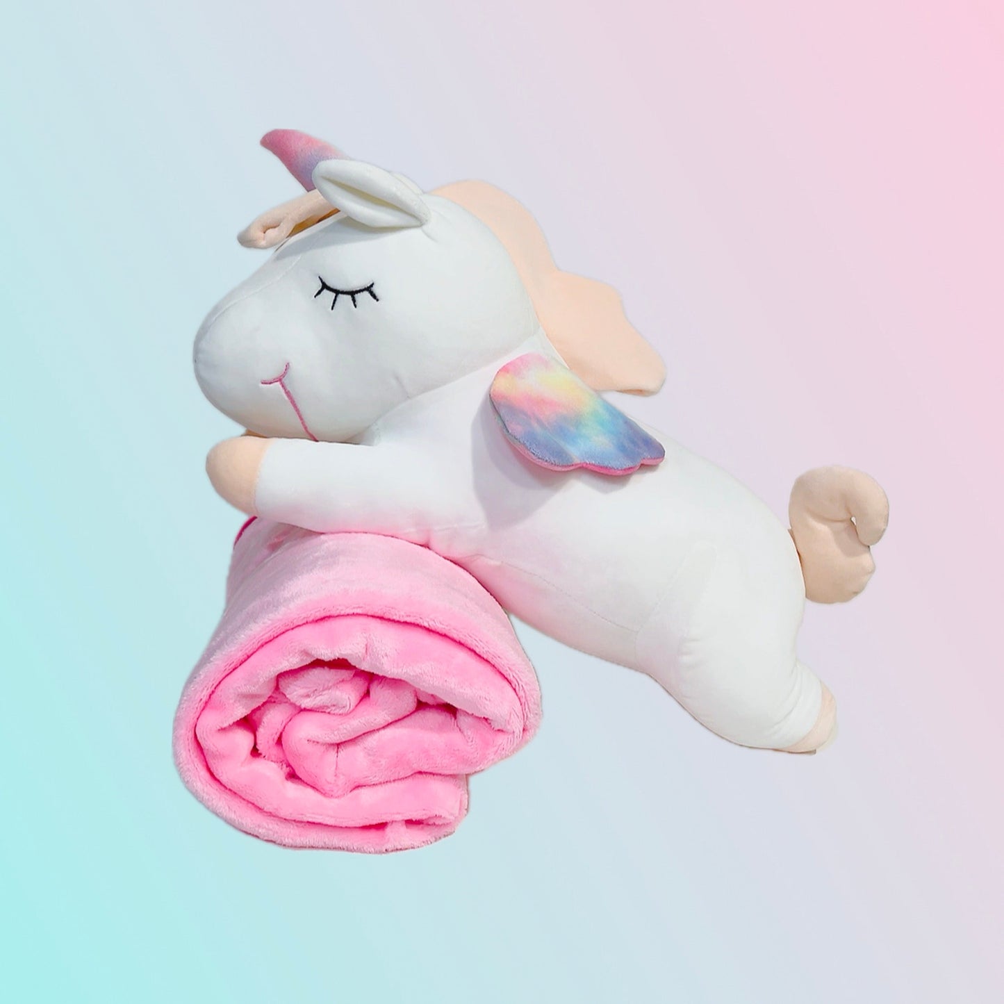 Adorable white unicorn plush toy with rainbow wings, featuring a cozy unicorn blanket tucked inside its belly. Soft and cuddly, this squishmallow-style stuffed animal doubles as a pillow for kids, making it the perfect plushie and comfort companion for bedtime or playtime. 2
