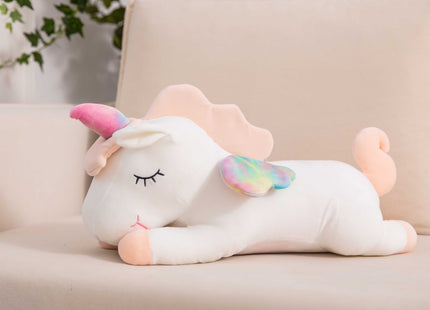 Adorable white unicorn plush toy with rainbow wings, featuring a cozy unicorn blanket tucked inside its belly. Soft and cuddly, this squishmallow-style stuffed animal doubles as a pillow for kids, making it the perfect plushie and comfort companion for bedtime or playtime. 3
