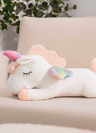 Adorable white unicorn plush toy with rainbow wings, featuring a cozy unicorn blanket tucked inside its belly. Soft and cuddly, this squishmallow-style stuffed animal doubles as a pillow for kids, making it the perfect plushie and comfort companion for bedtime or playtime. 3

