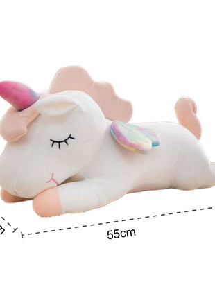 Adorable white unicorn plush toy with rainbow wings, featuring a cozy unicorn blanket tucked inside its belly. Soft and cuddly, this squishmallow-style stuffed animal doubles as a pillow for kids, making it the perfect plushie and comfort companion for bedtime or playtime. 5
