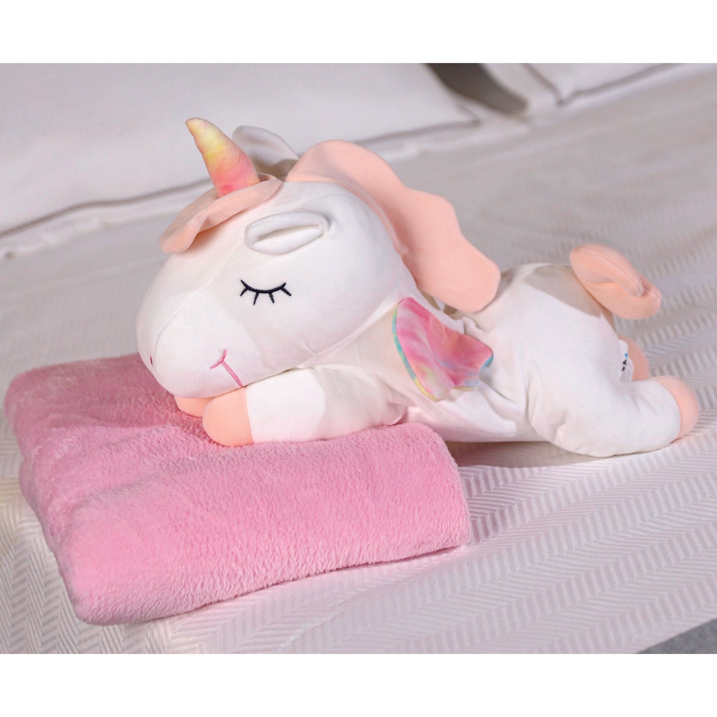 Adorable white unicorn plush toy with rainbow wings, featuring a cozy unicorn blanket tucked inside its belly. Soft and cuddly, this squishmallow-style stuffed animal doubles as a pillow for kids, making it the perfect plushie and comfort companion for bedtime or playtime. 7
