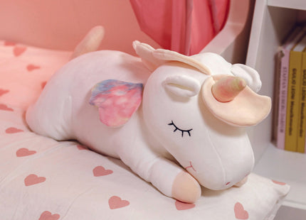 Adorable white unicorn plush toy with rainbow wings, featuring a cozy unicorn blanket tucked inside its belly. Soft and cuddly, this squishmallow-style stuffed animal doubles as a pillow for kids, making it the perfect plushie and comfort companion for bedtime or playtime. 8
