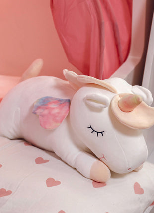 Adorable white unicorn plush toy with rainbow wings, featuring a cozy unicorn blanket tucked inside its belly. Soft and cuddly, this squishmallow-style stuffed animal doubles as a pillow for kids, making it the perfect plushie and comfort companion for bedtime or playtime. 8
