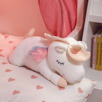 Adorable white unicorn plush toy with rainbow wings, featuring a cozy unicorn blanket tucked inside its belly. Soft and cuddly, this squishmallow-style stuffed animal doubles as a pillow for kids, making it the perfect plushie and comfort companion for bedtime or playtime. 8
