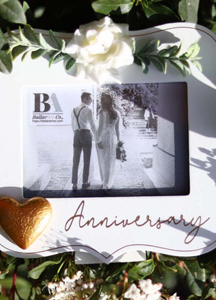  Elegant white wooden photo frame decorated with white flowers, hearts, and the word "Anniversary," making it a beautiful and thoughtful anniversary gift for couples, capturing special moments in a romantic keepsake. 4
