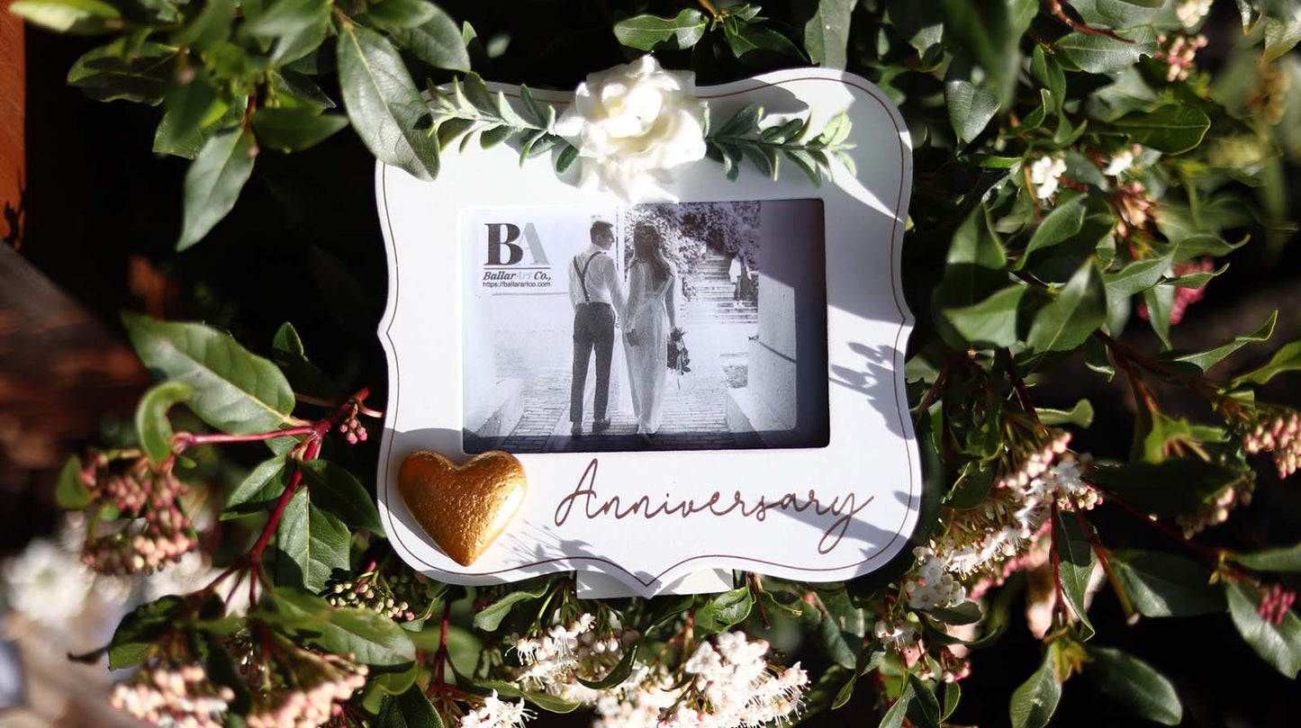  Elegant white wooden photo frame decorated with white flowers, hearts, and the word "Anniversary," making it a beautiful and thoughtful anniversary gift for couples, capturing special moments in a romantic keepsake. 4
