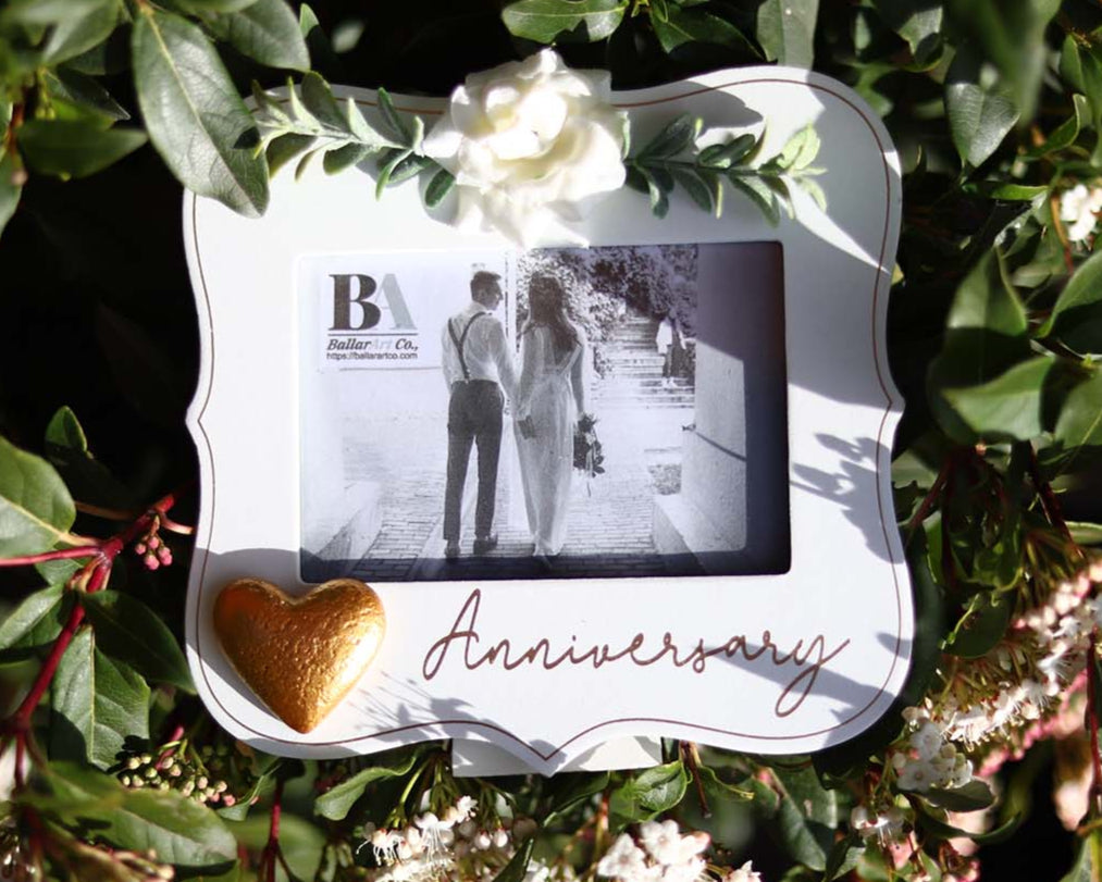  Elegant white wooden photo frame decorated with white flowers, hearts, and the word "Anniversary," making it a beautiful and thoughtful anniversary gift for couples, capturing special moments in a romantic keepsake. 4
