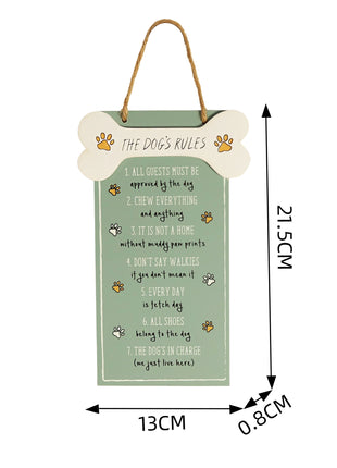 Adorable wooden hanging sign featuring "The Dog's Rules" with a bone-shaped accent and cute dog paw illustrations. Ideal for wall or door decor, this green wooden plaque makes a charming gift for dog lovers and adds personality to any pet-friendly home.