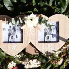 Wooden double photo frame featuring two interlocking hearts, each holding a photo, and adorned with a white flower. A perfect romantic gift for couples, weddings, or anniversaries, symbolizing love and togetherness. 2
