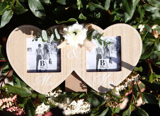 Wooden double photo frame featuring two interlocking hearts, each holding a photo, and adorned with a white flower. A perfect romantic gift for couples, weddings, or anniversaries, symbolizing love and togetherness. 2
