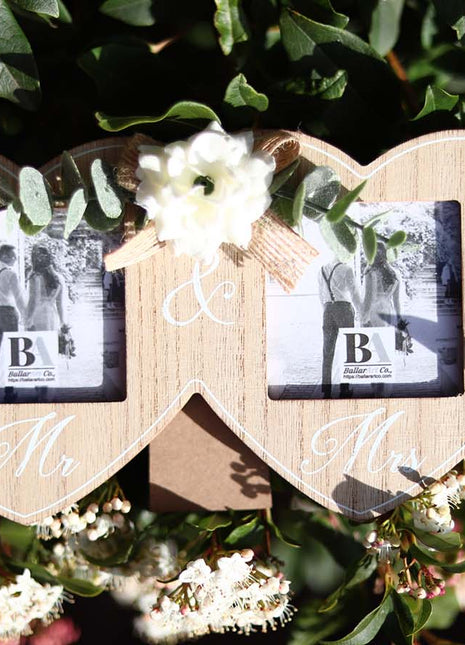 Wooden double photo frame featuring two interlocking hearts, each holding a photo, and adorned with a white flower. A perfect romantic gift for couples, weddings, or anniversaries, symbolizing love and togetherness. 2
