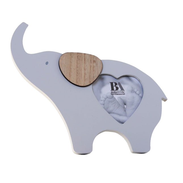 Wooden elephant-shaped baby photo frame with a photo slot in the belly, crafted as a charming home decor piece and keepsake, perfect for displaying baby pictures and enhancing nursery or home spaces. 1
