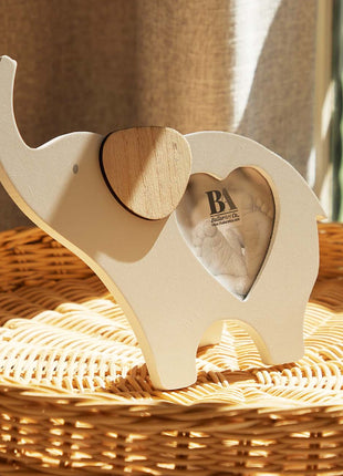 Wooden elephant-shaped baby photo frame with a photo slot in the belly, crafted as a charming home decor piece and keepsake, perfect for displaying baby pictures and enhancing nursery or home spaces. 3
