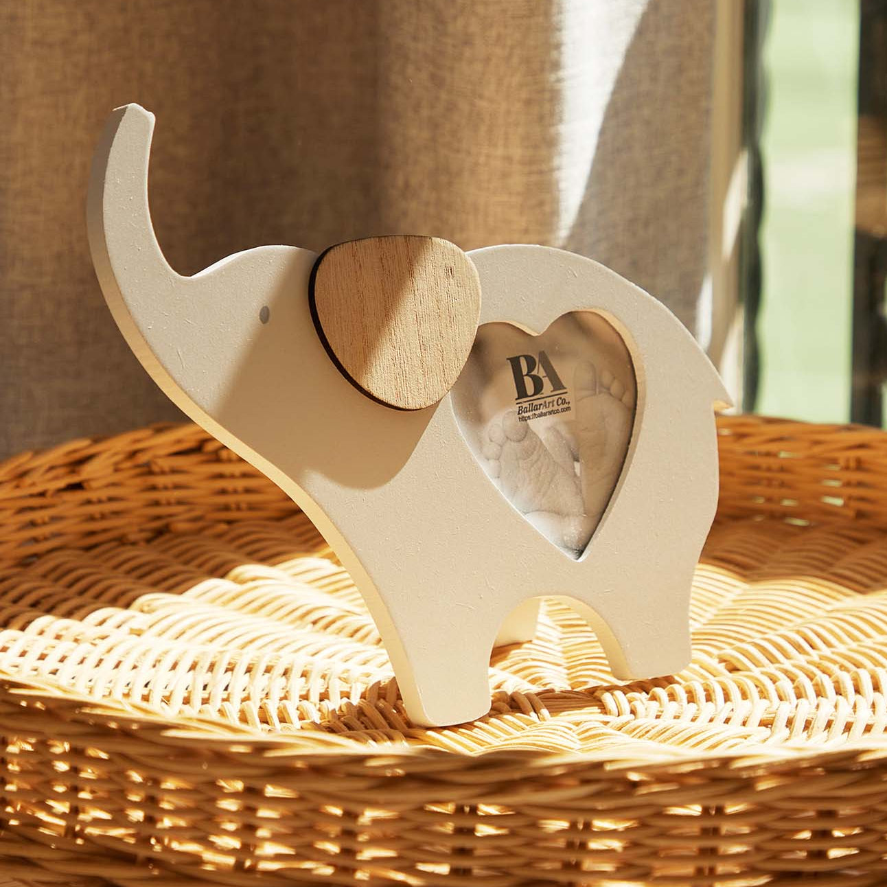 Wooden elephant-shaped baby photo frame with a photo slot in the belly, crafted as a charming home decor piece and keepsake, perfect for displaying baby pictures and enhancing nursery or home spaces. 3

